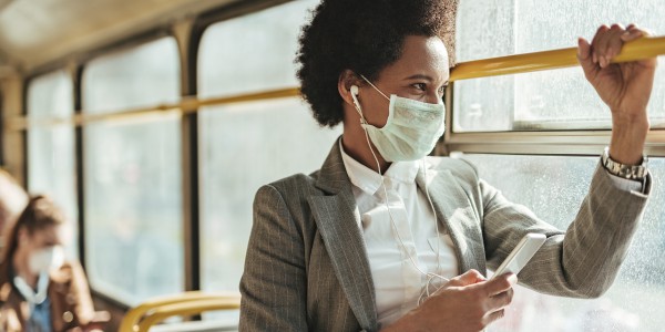 Woman on bus wearing face mask