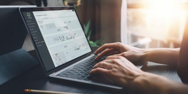 Woman using laptop, viewing CODA digital twin
