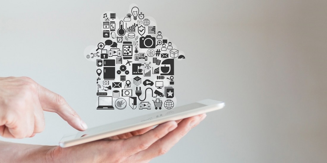 hand-holding-ipad-with-house-graphic.jpg